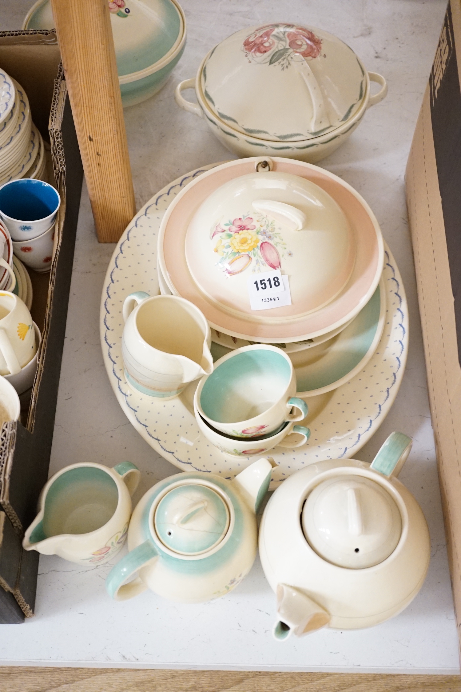 A collection of Susie Cooper ceramics and tablewares including tureens, an oval platter, cups and saucers